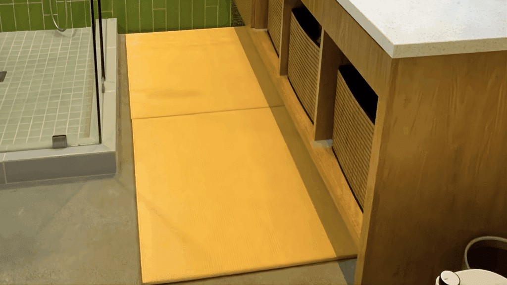 tatami mat flooring area beside shower and wooden vanity in minimalist japanese bathroom design