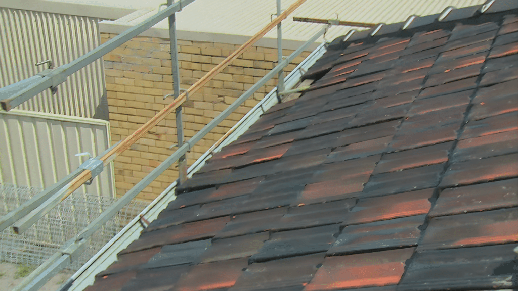 tile roof cleaning finished with clean tiles and inspecting roof surface to ensure all dirt have been removed