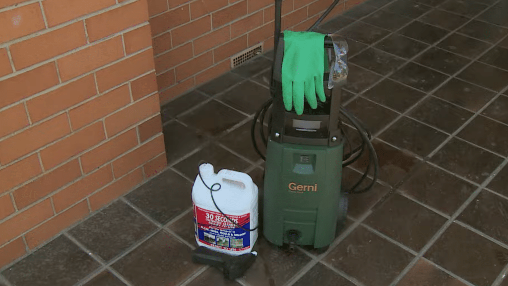 tile roof cleaning safety gear setup with pressure washer gloves and cleaning solution