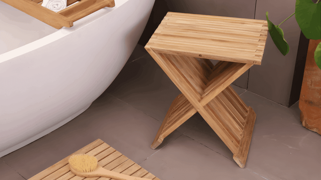 wood folding stool beside bathtub with wooden bath tray and brush in calm spa setting inspired by japanese bathroom design