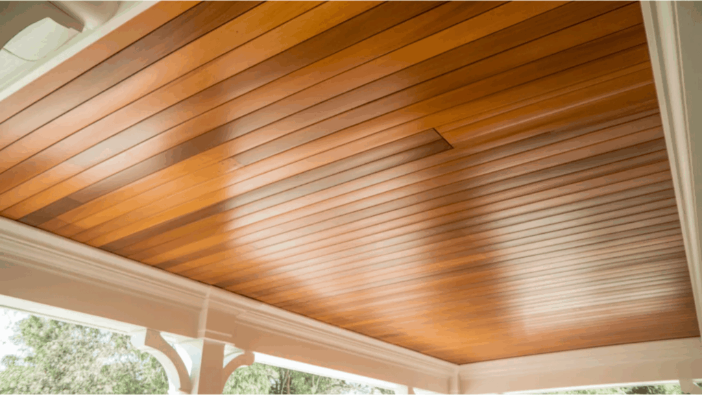 wood porch ceiling with a rich warm tone porch ceiling ideas