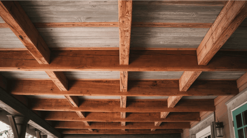 wooden beams on a porch ceiling with metal roof panels porch ceiling ideas