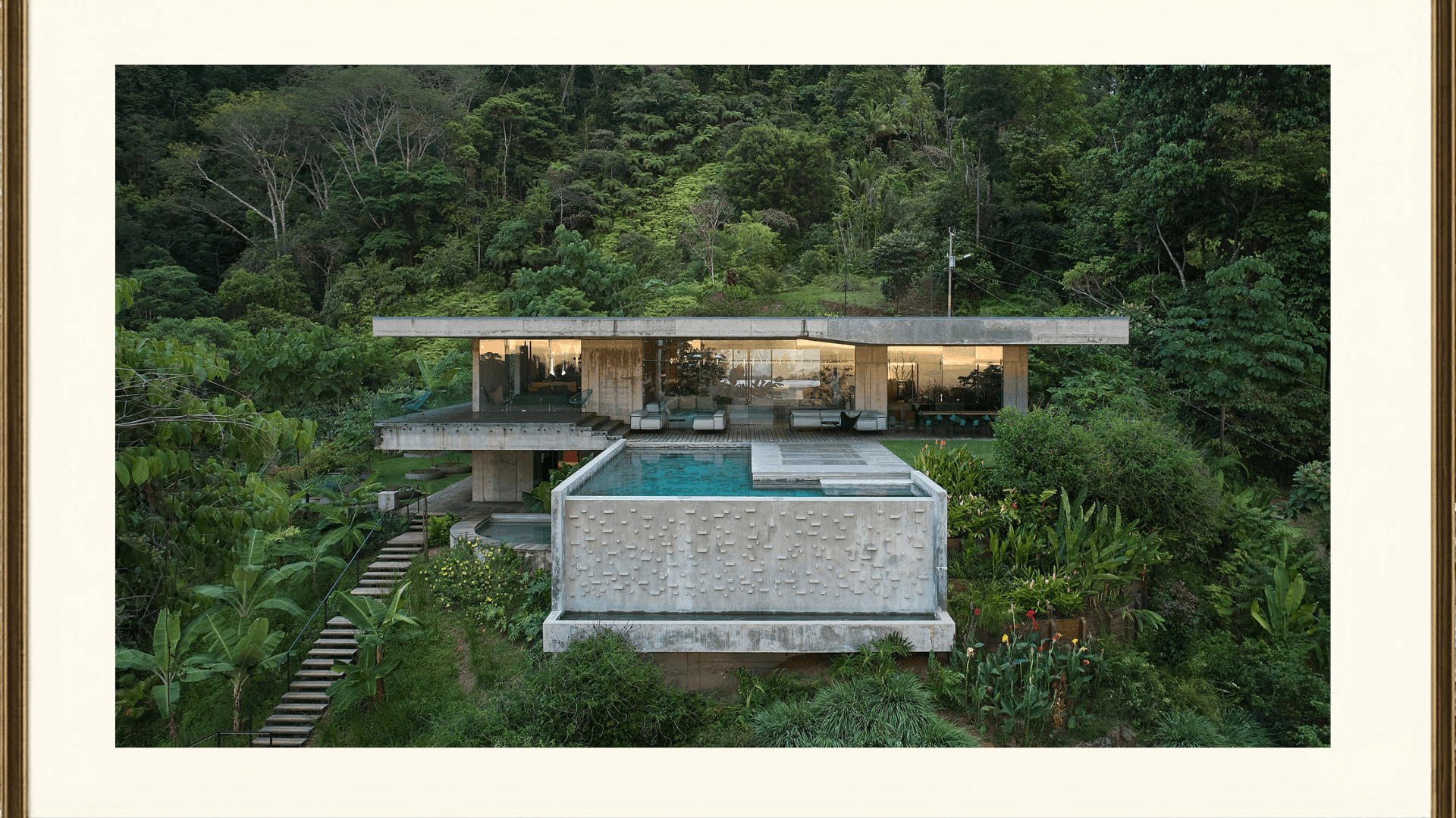 a jungle house in brazil one of the eco brutalist buildings with rooftop pool surrounded by dense trees (4) (1)