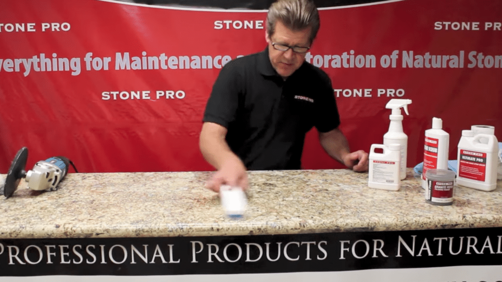 applying granite sealer evenly across surface in how to polish granite countertops to protect shine and prevent stains