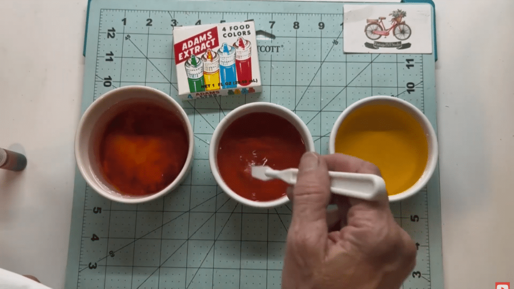 bowls of colored water prepared for dyeing filters