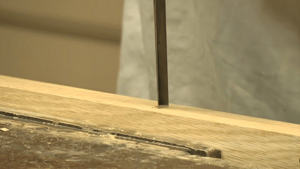 chopping the mortise to create a precise cavity for the tenon in woodworking