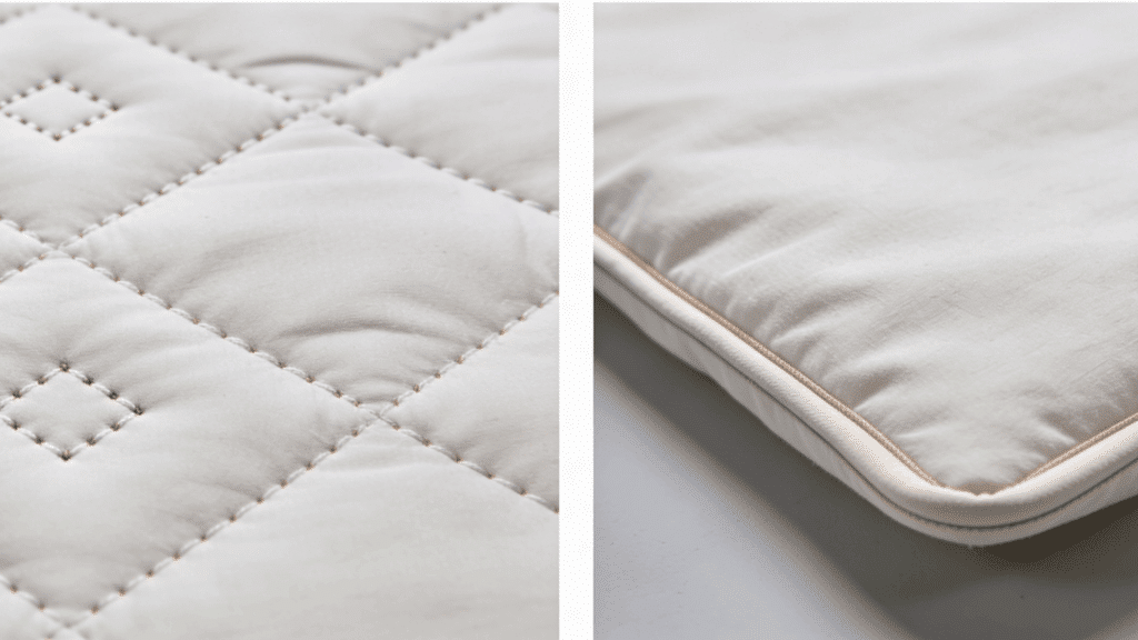 close up of quilt stitching pattern and soft padded fabric edge showing texture and layered bedding material