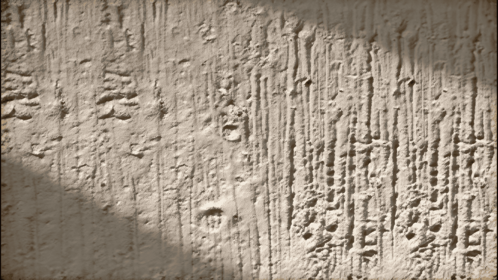 close up of rough textured wall with vertical grooves and uneven plaster surface in soft light
