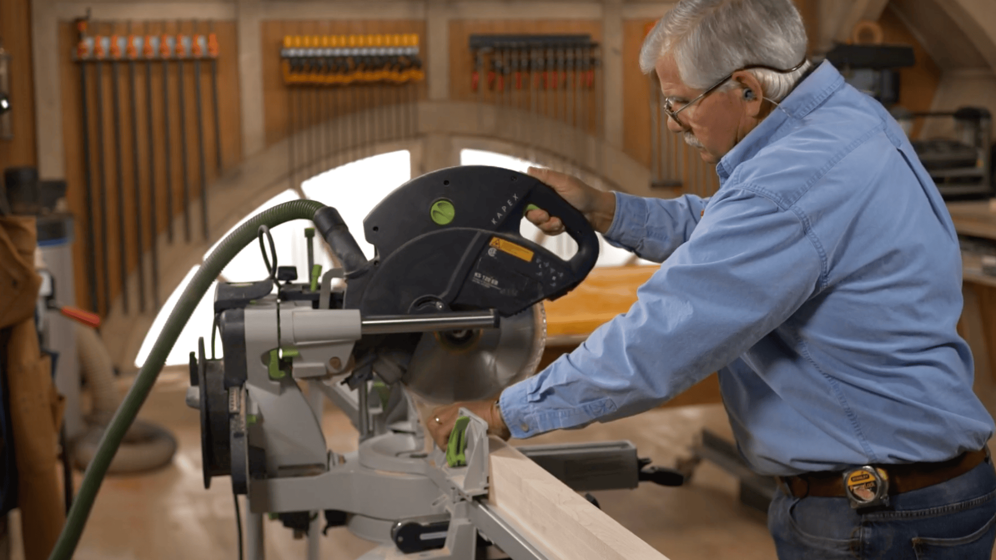 cutting wood leg angles for diy clothes rack using saw to shape base for stable frame setup