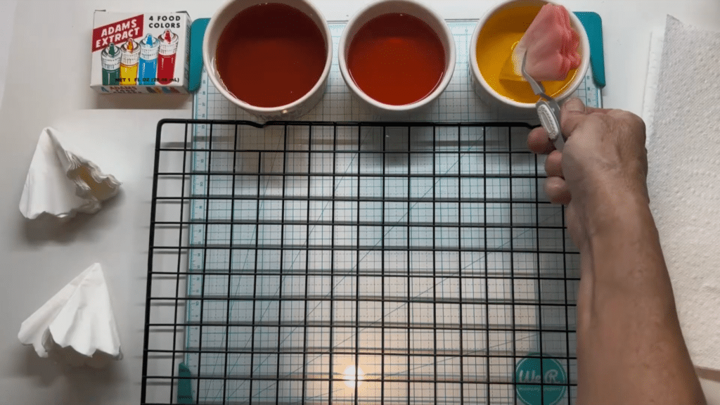 dipping coffee filters into colored water for dyeing
