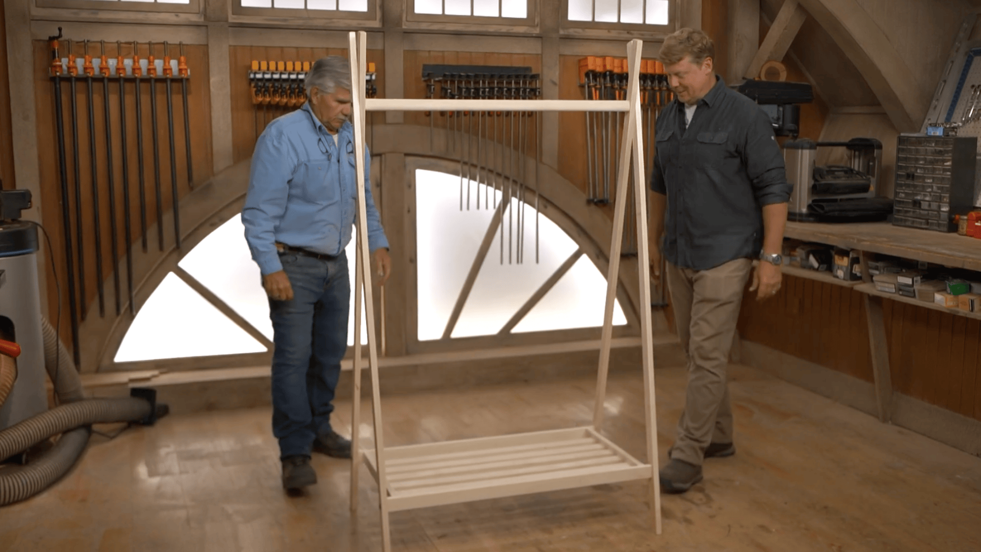 final assembly of diy clothes rack with wooden frame and shelf ready for use after finishing build