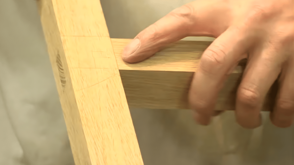 finishing the joint by smoothing and refining the mortise and tenon
