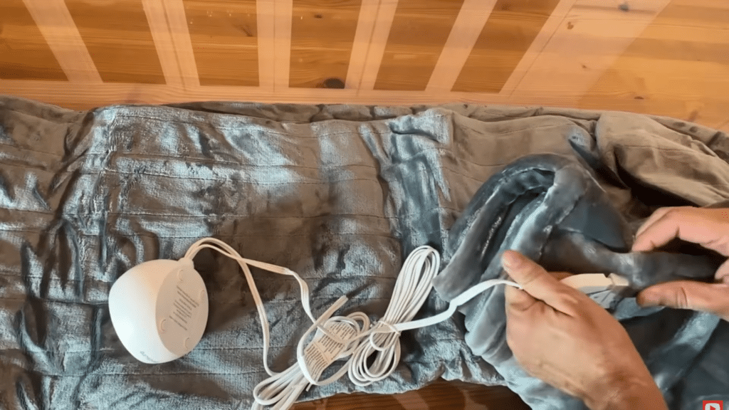 folding electric blanket loosely with cord after drying