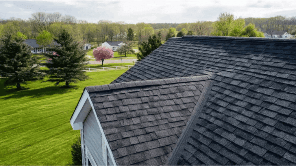 house roof with asphalt shingles in suburban area showing roof leak repair cost concept