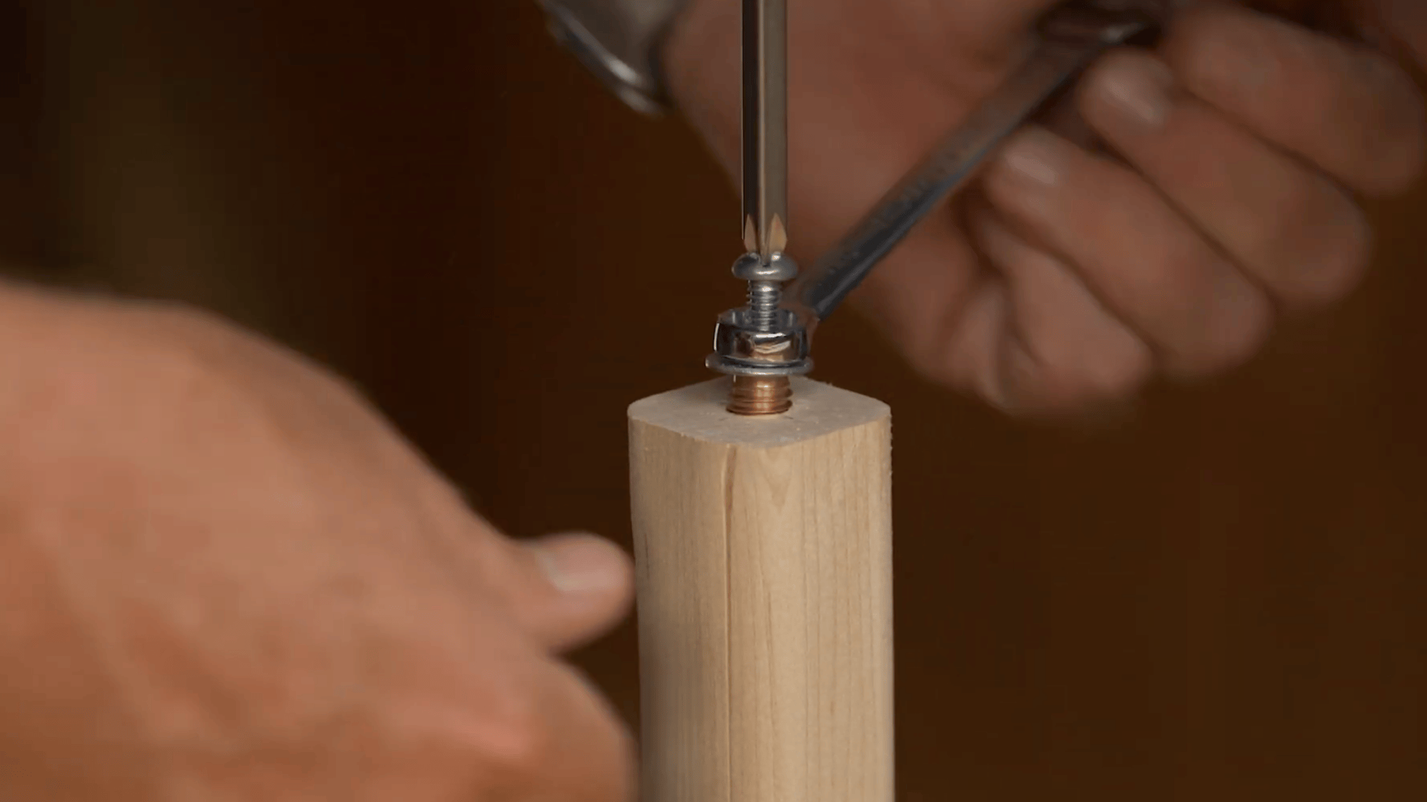 installing threaded insert into wooden pole for diy clothes rack using bolt and tool for strong joint connection