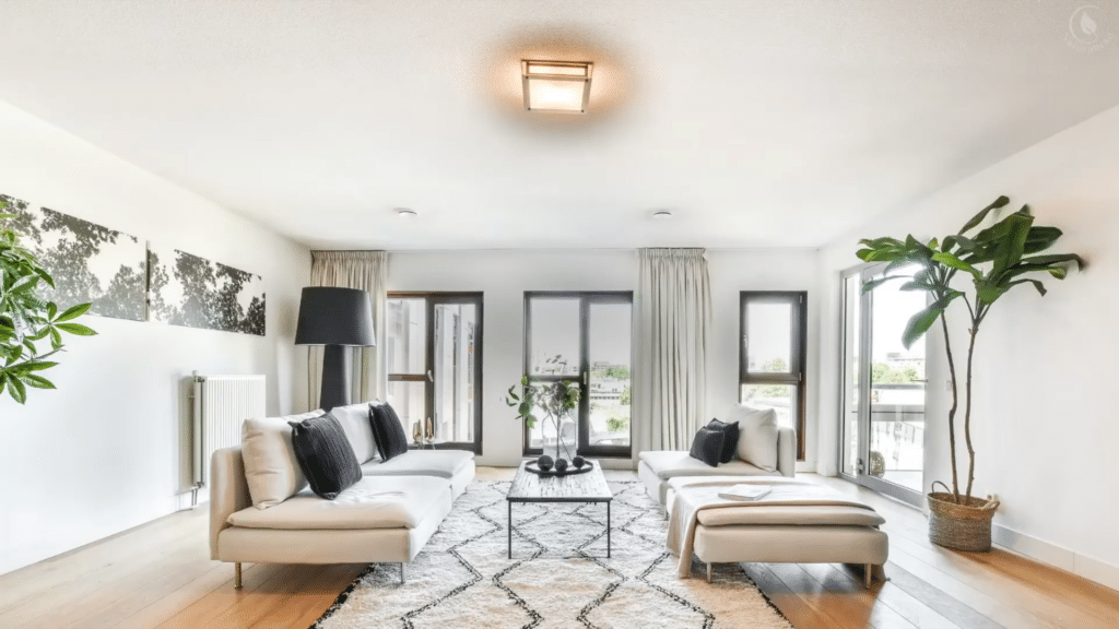 living room layout with sofa facing entry and seating arrangement