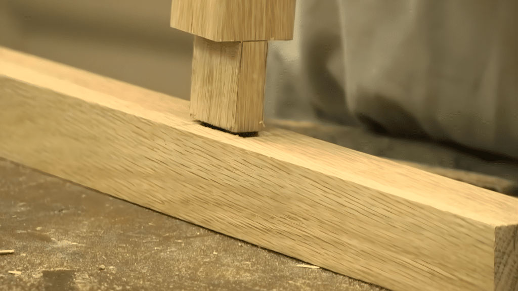 making final adjustments to the tenon fit for a snug and secure connection