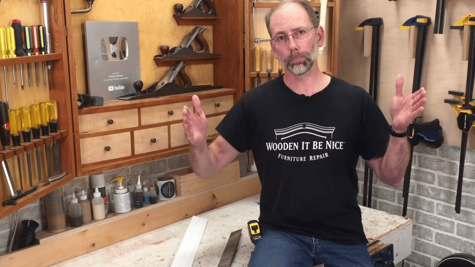 man explaining measuring mirror height and width before cutting trim to ensure proper fit and clean frame finish