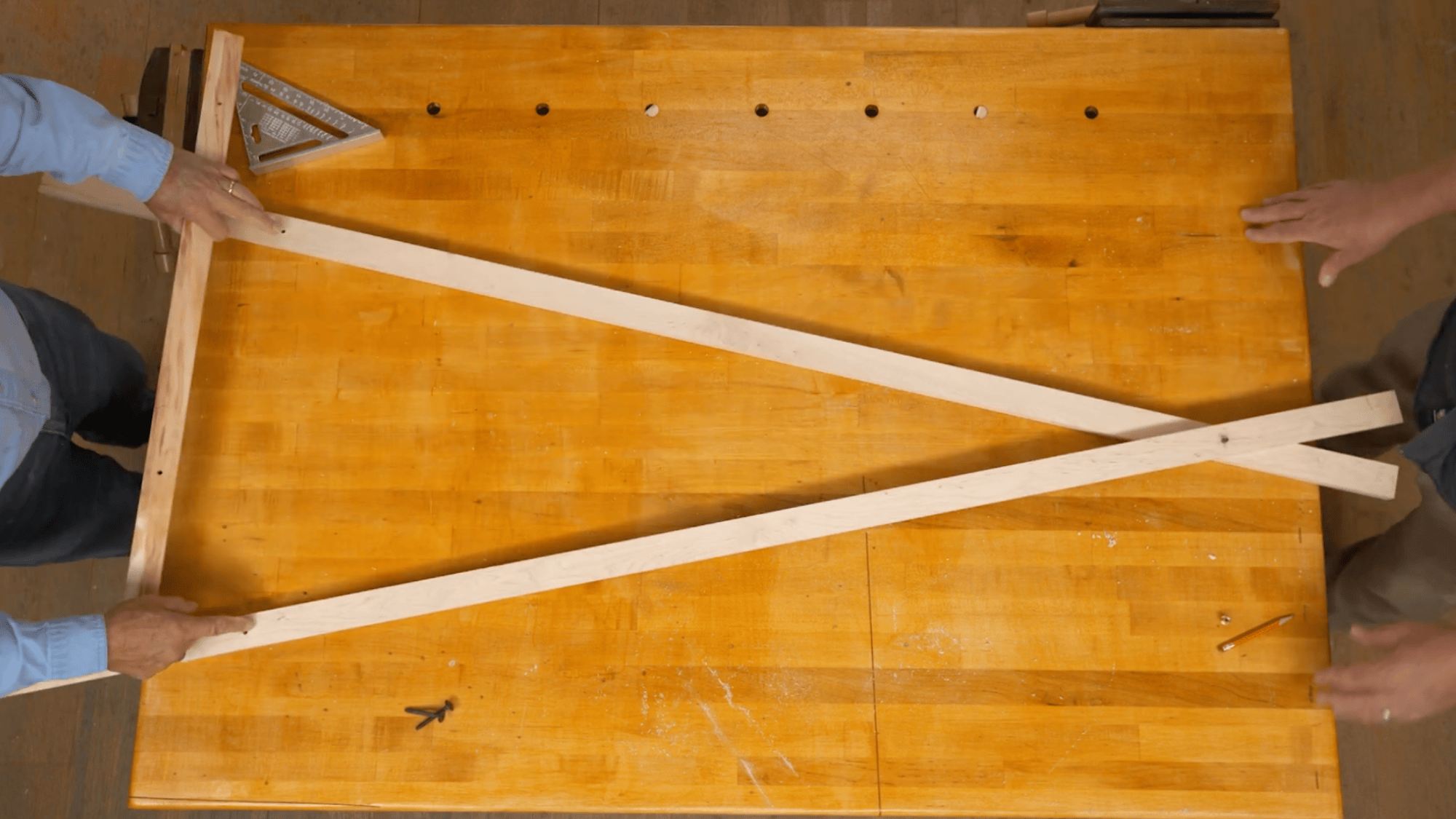 measuring leg angle for diy clothes rack using wood pieces and square tool to set correct frame position