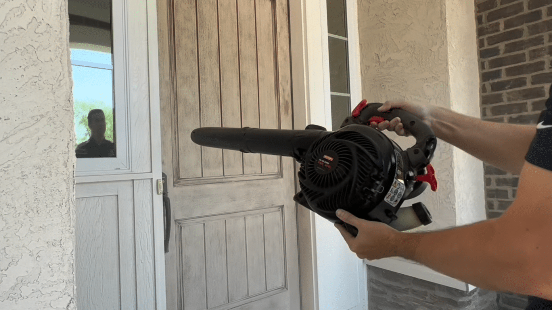 painting front door black preparation using leaf blower to remove sanding dust from exterior door before painting