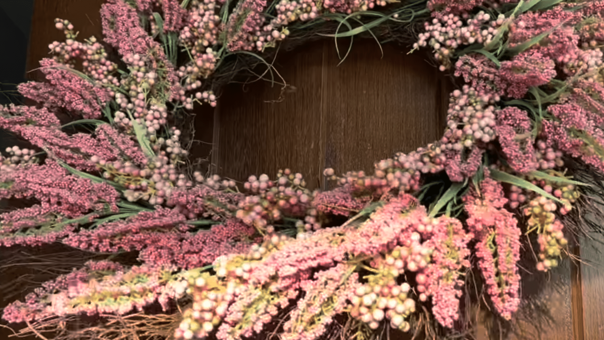painting front door black with pink floral wreath hanging on wooden door entrance decoration