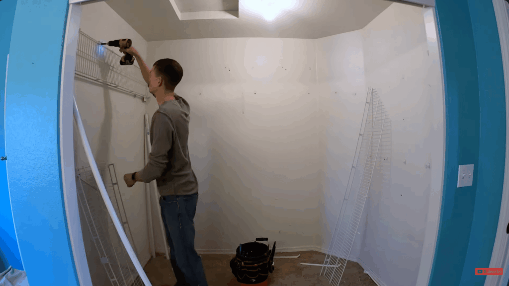 prepping the closet space by removing old shelves patching holes and repainting the walls