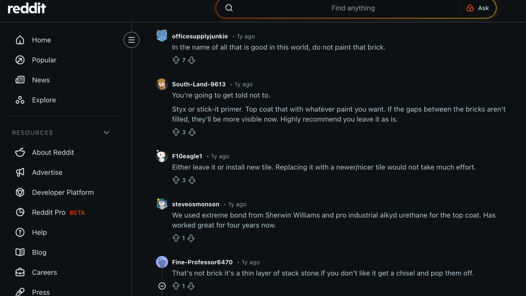 reddit comments warning against painting a brick fireplace and suggesting alternatives like primer tile or leaving it as is