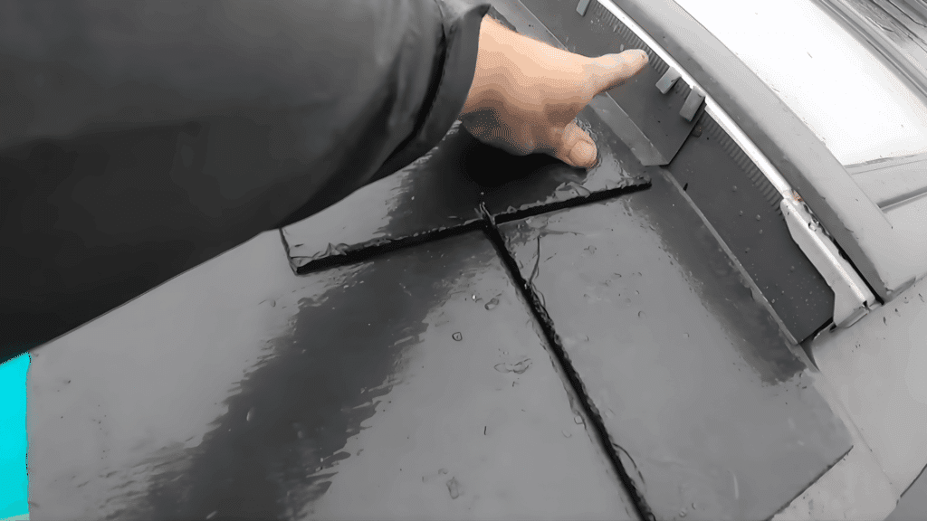 slate roof installation showing attention to detail with tiles aligning near the edge and trim