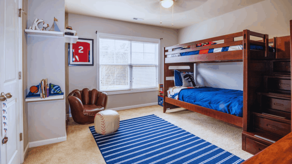 sports themed teen bedroom with bunk bed jersey decor and blue rug
