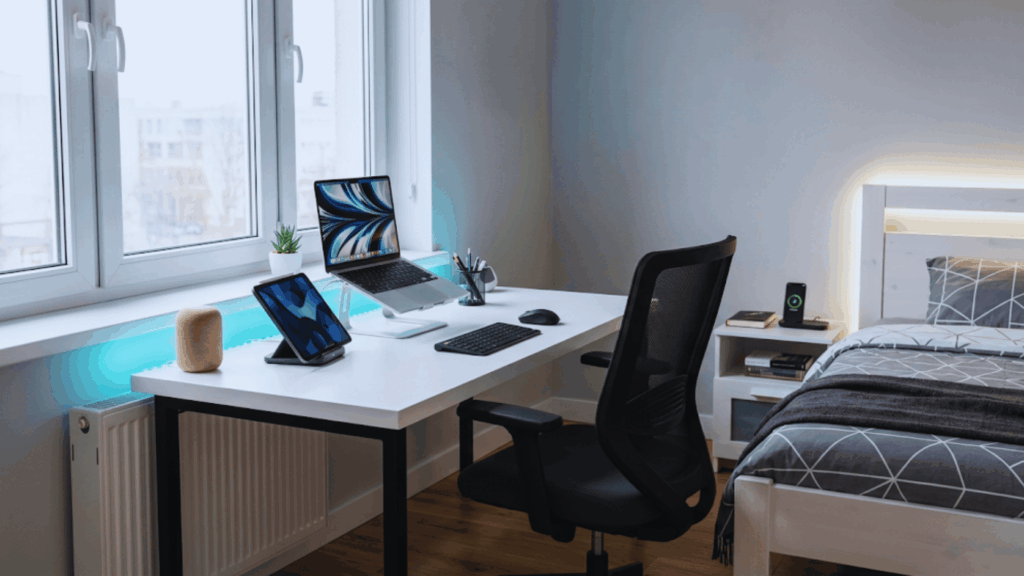 tech inspired bedroom with clean desk laptop smart lighting setup