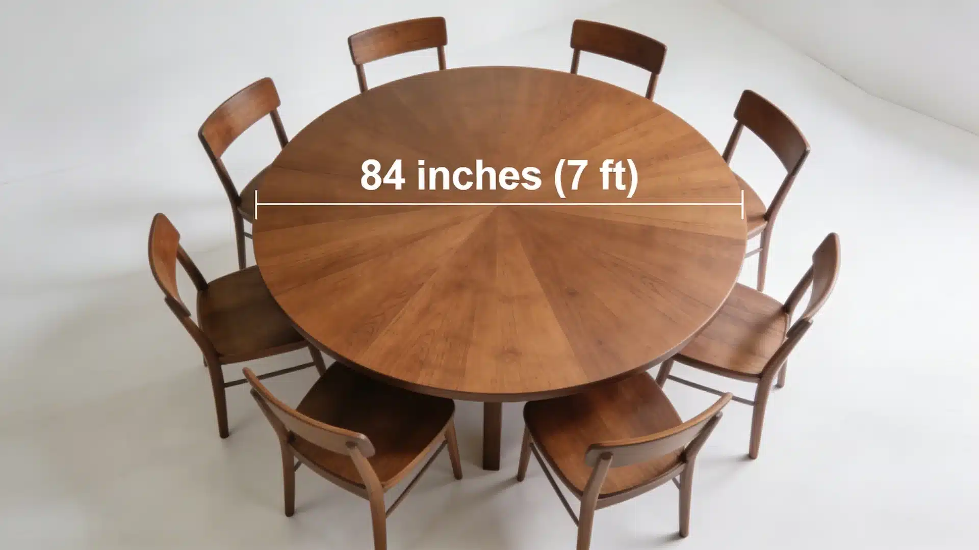 84 inch round wooden dining table with chairs showing 7 ft diameter measurement across the tabletop in a clean bright room