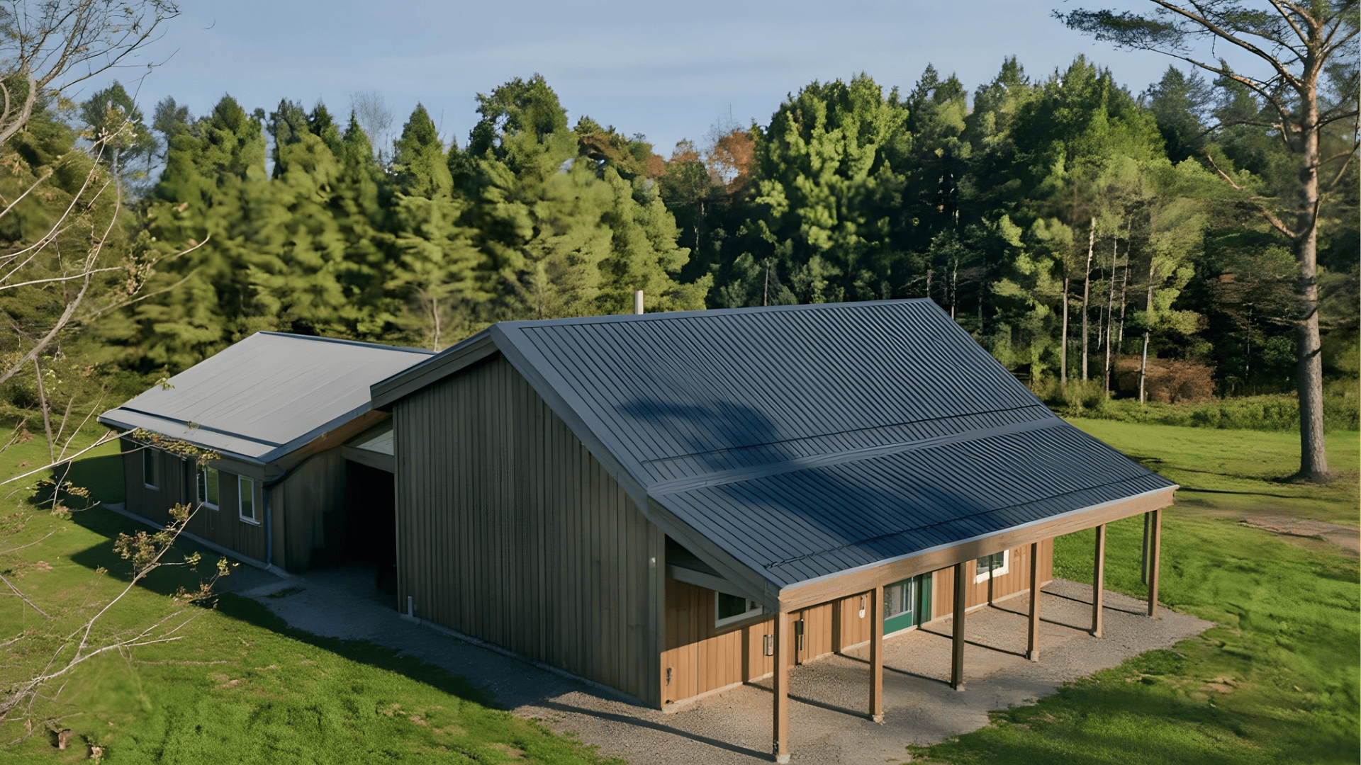 a house with a gable roof type covered in metal roofing for a durable and modern design