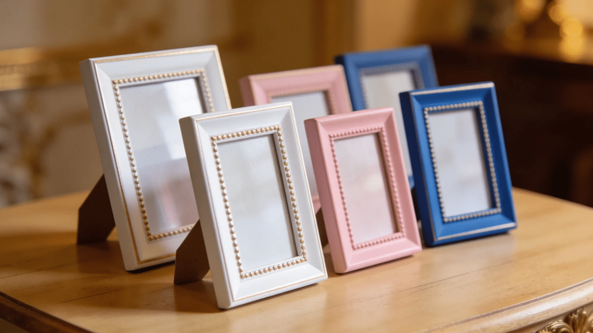 a set of colorful decorative photo frames displayed on a table for favorite things party gift ideas