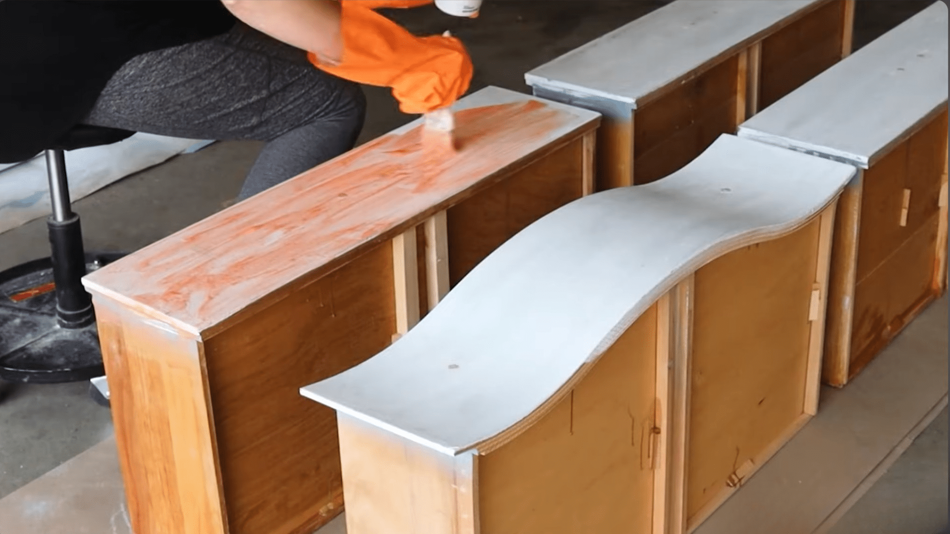applying chemical paint stripper evenly on wood surface to soften and lift old paint layers (3)