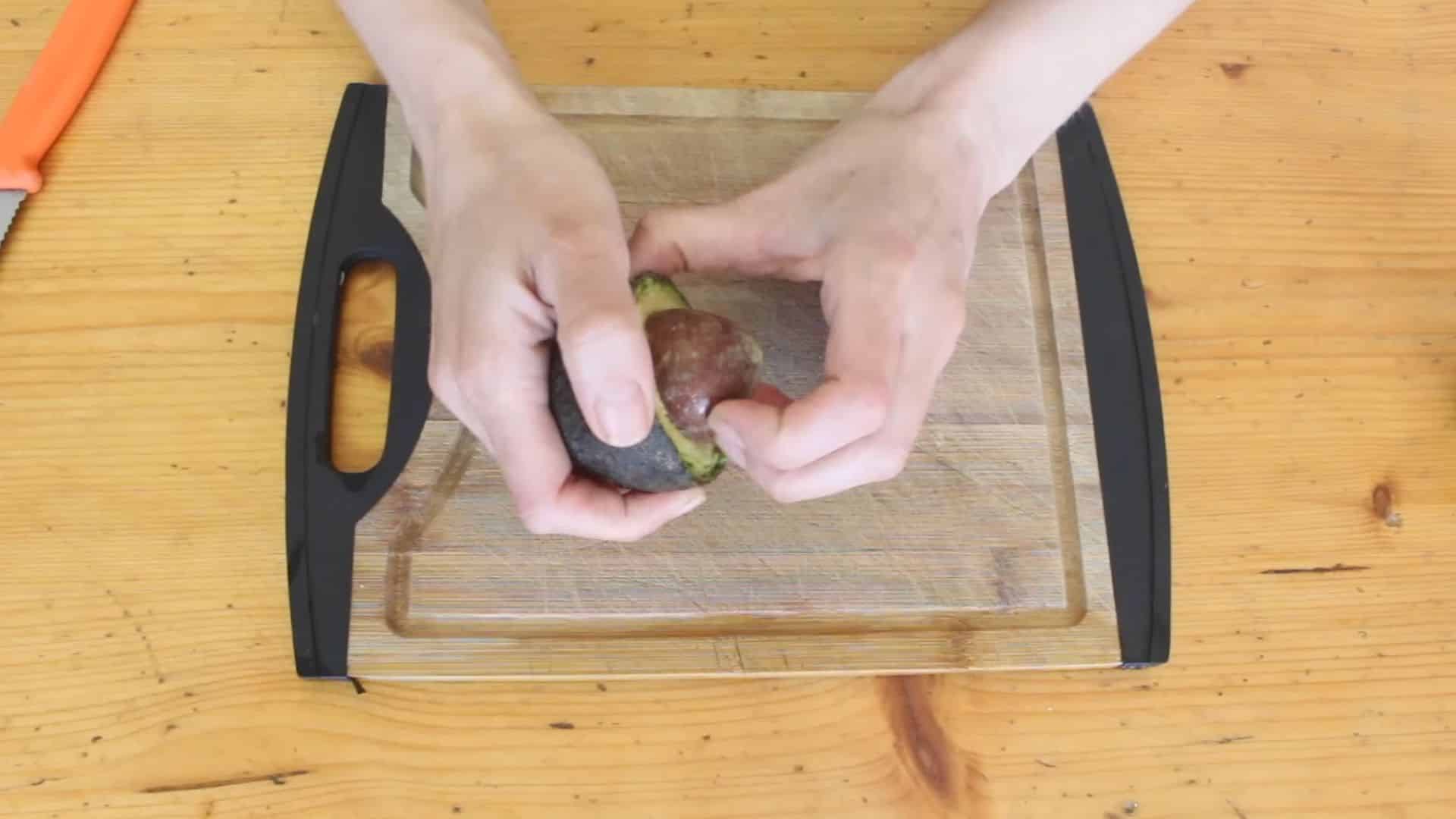 avocado seed removed carefully from fruit showing healthy seed ready for growing process