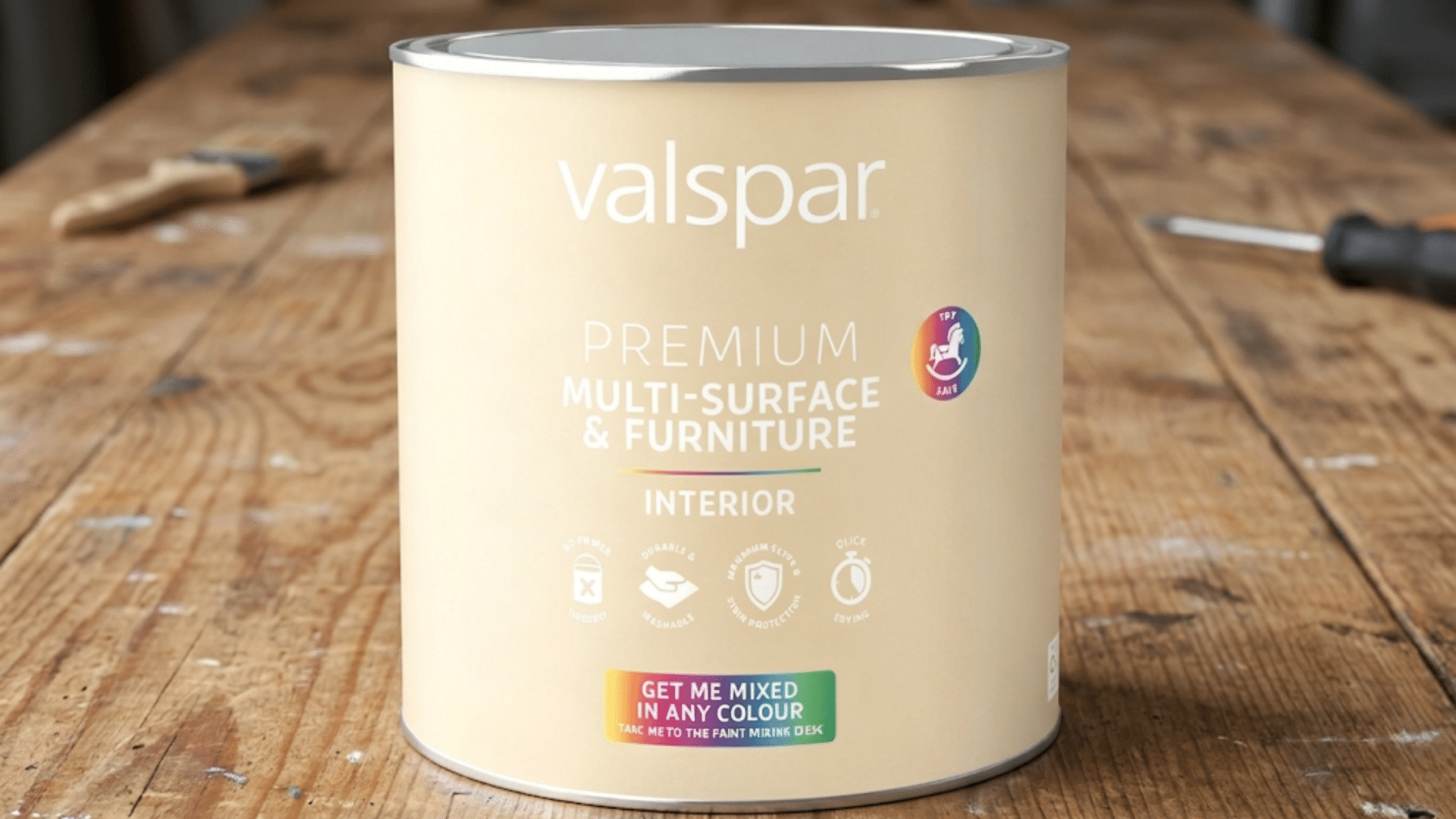 beige valspar premium multi surface paint can on wooden table with tools in background showing valspar vs sherwin williams comparison