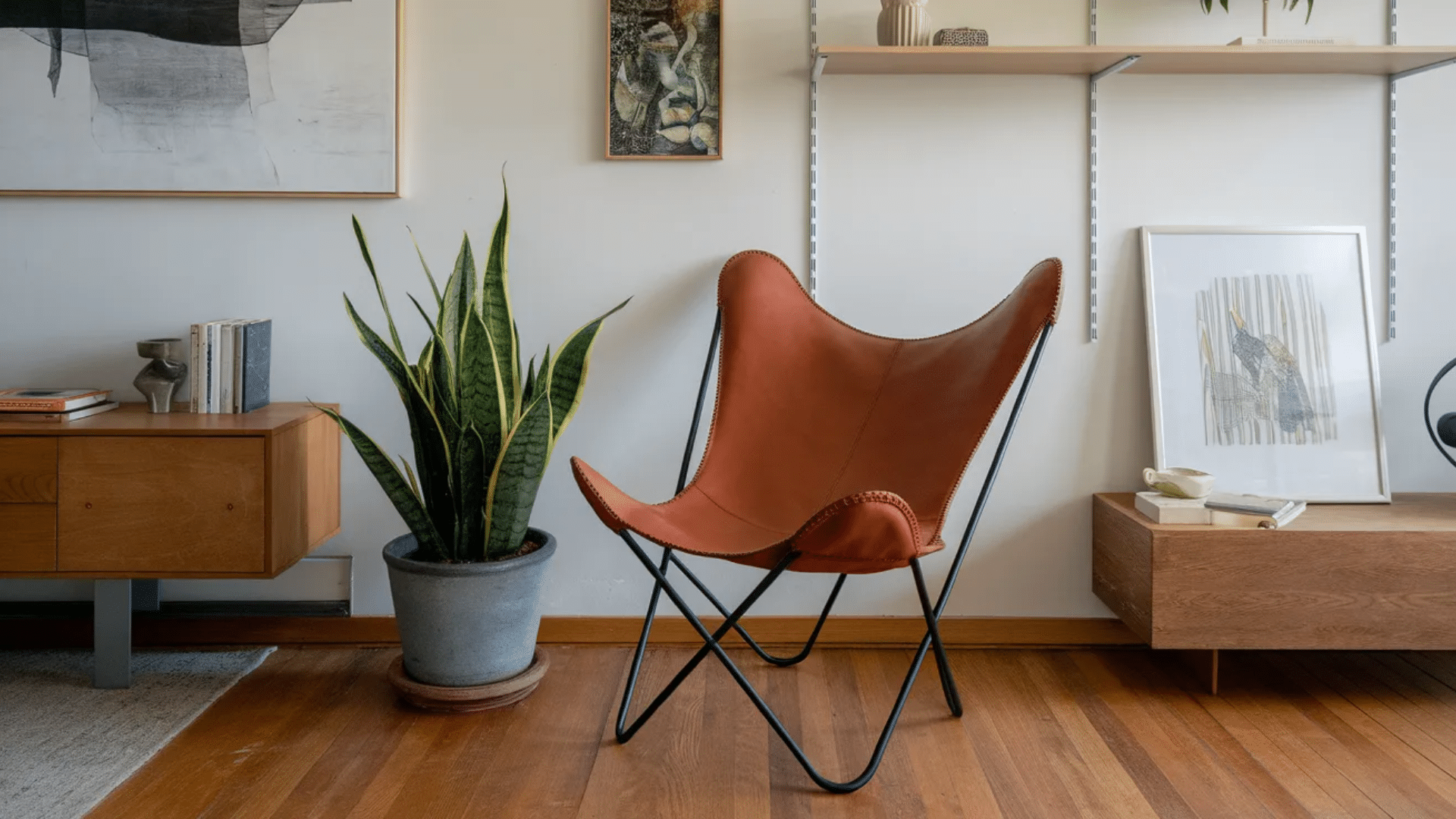 butterfly chair with sling fabric seat stretched across folding metal frame for lightweight casual seating