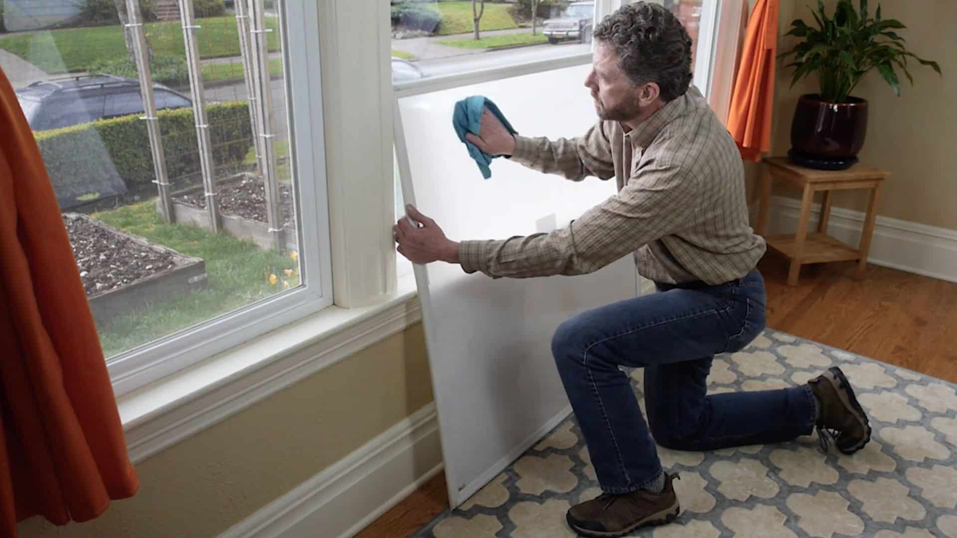 cleaning window frame and insert surface to remove dust before final installation