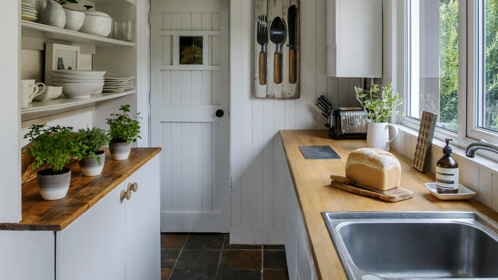 cozy farmhouse galley kitchen designs with wooden countertops