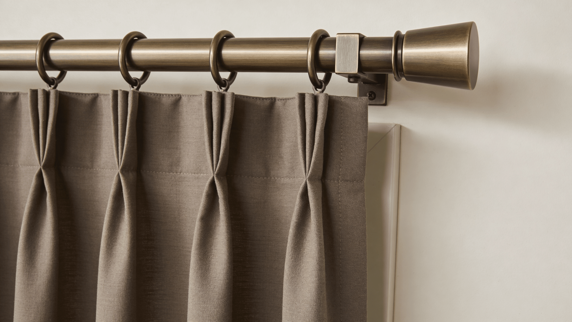 curtain rings and rod with pleated fabric detail