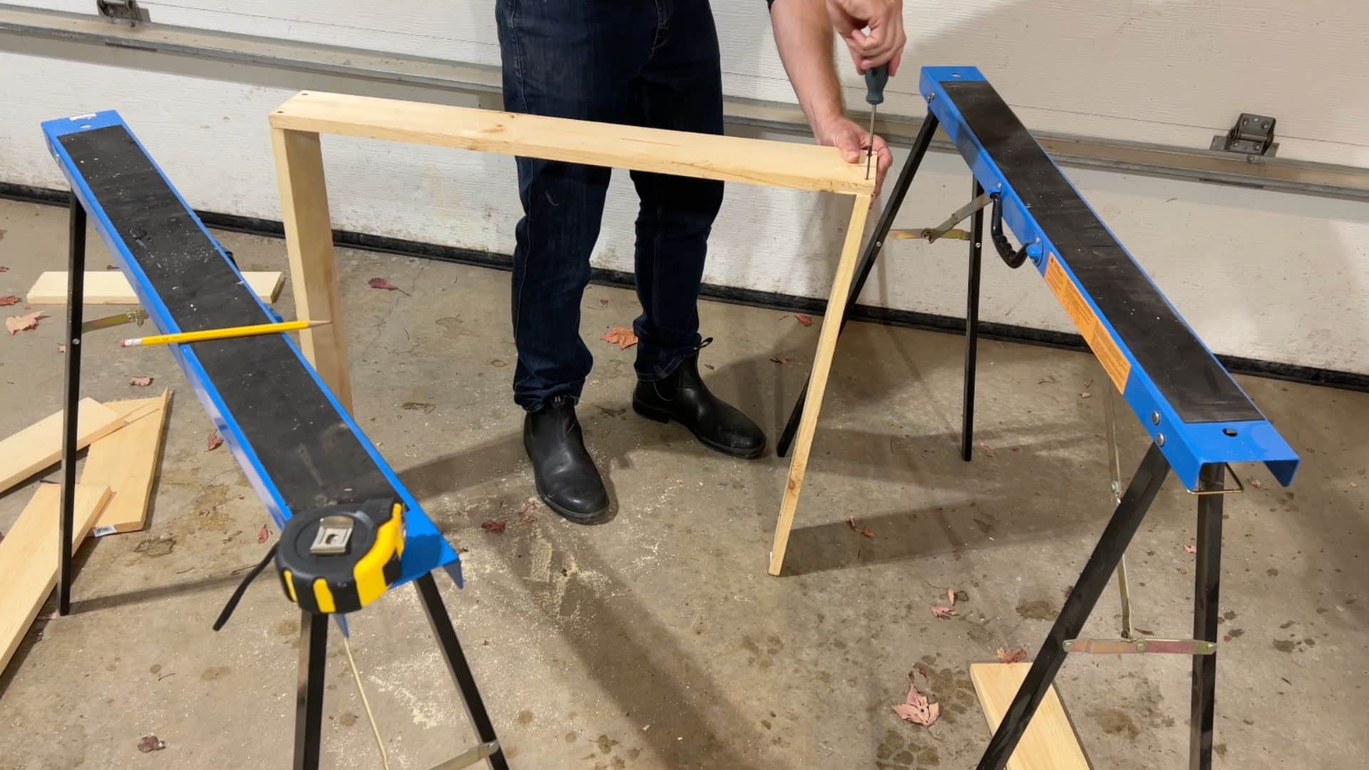 cutting wooden boards and assembling rectangular frame for window plug structure