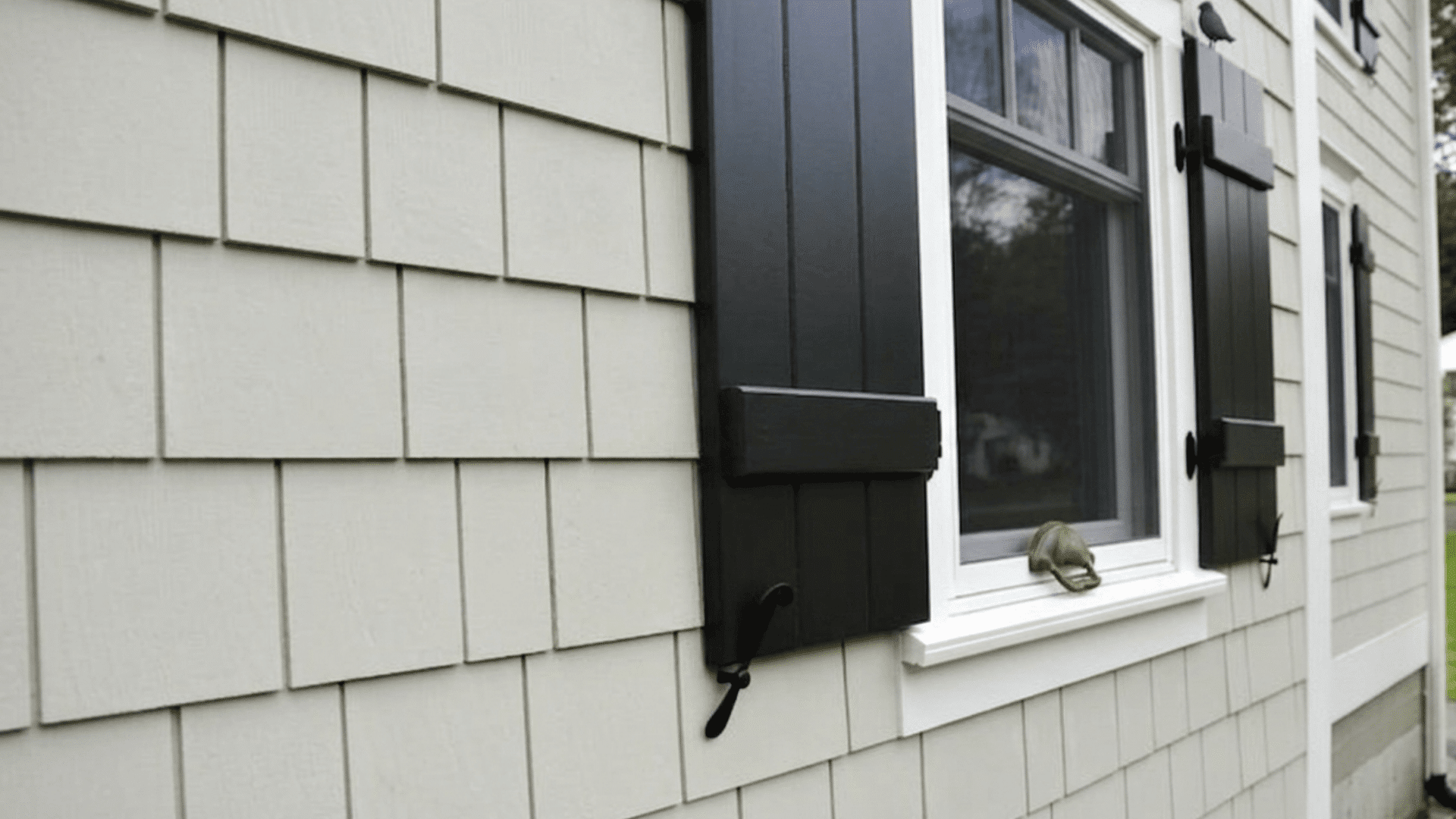 fiber cement siding panels on house exterior near window clean modern wall detail with overlapping boards