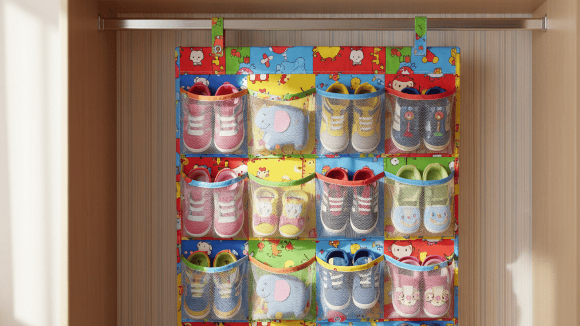 hanging shoe organizer used for toy storage with pockets holding kids items in neat playroom setup
