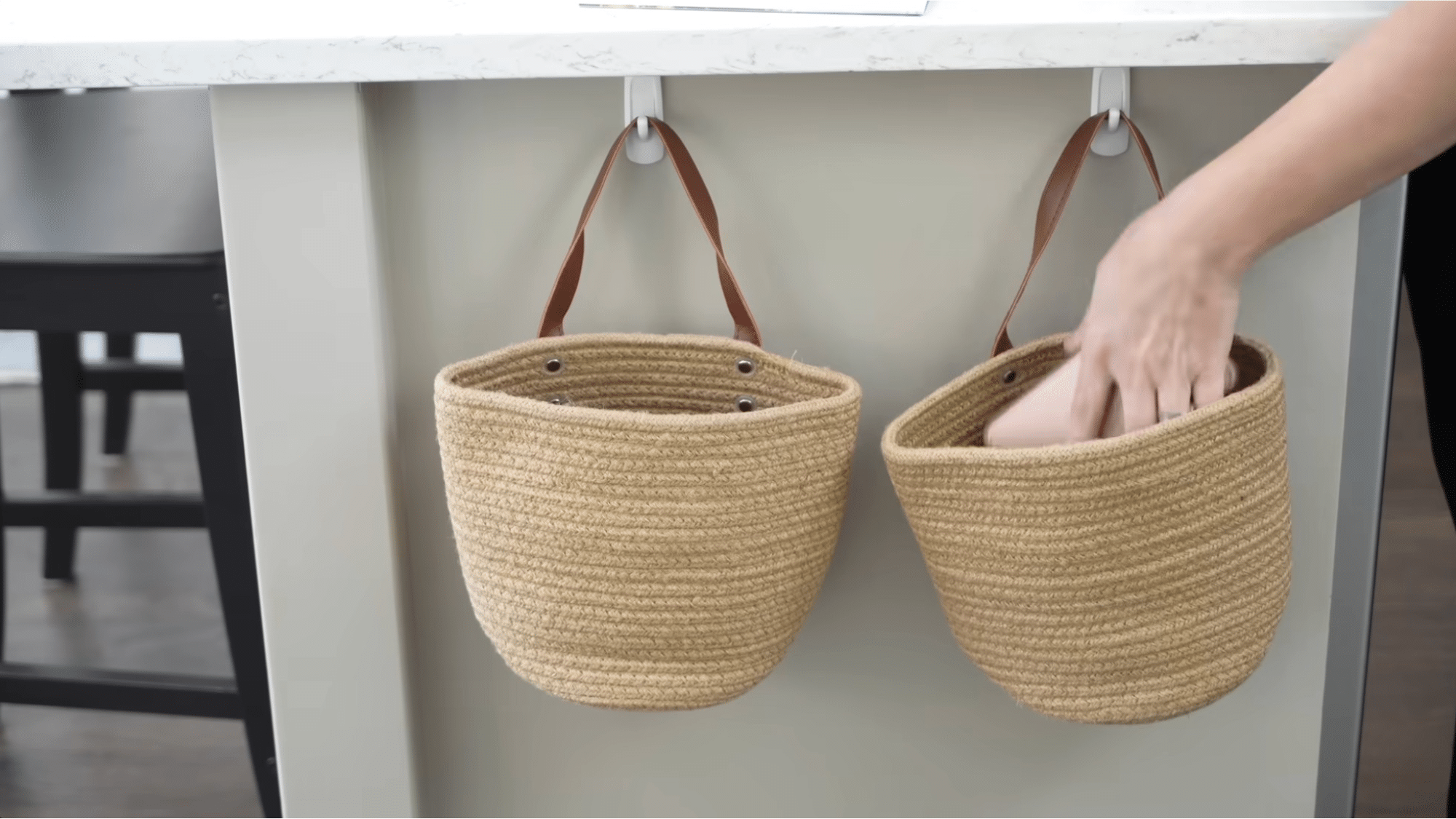 hooks with hanging baskets under shelf showing smart storage ideas for how to organize your home efficiently