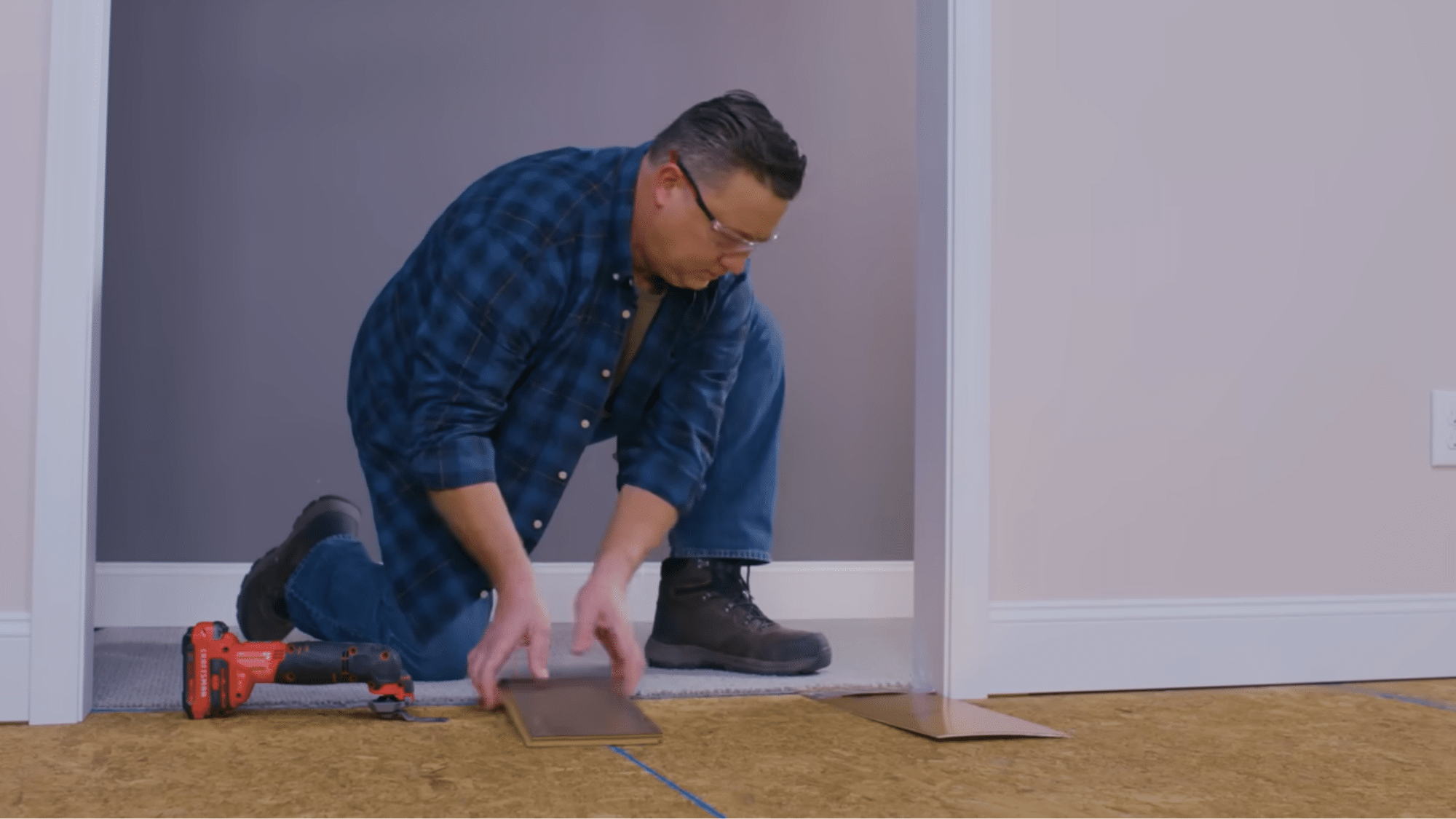 Laminate flooring planks acclimating inside room before installation