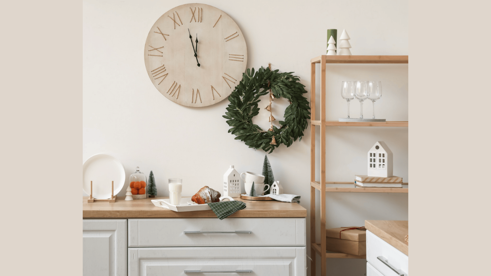 large wall clock above kitchen counter with wooden shelf and decorative items