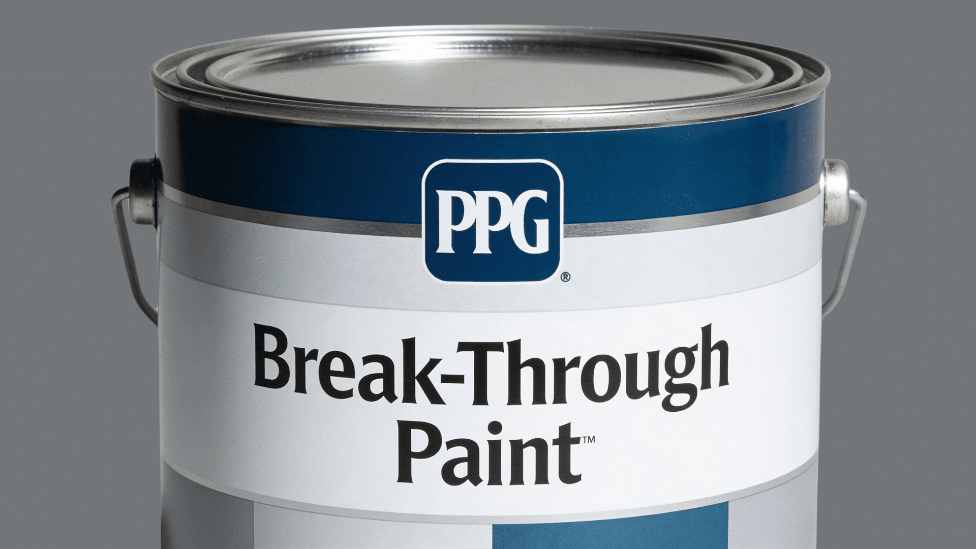 metal paint can with ppg label and break through paint text on white and blue container with lid and handle