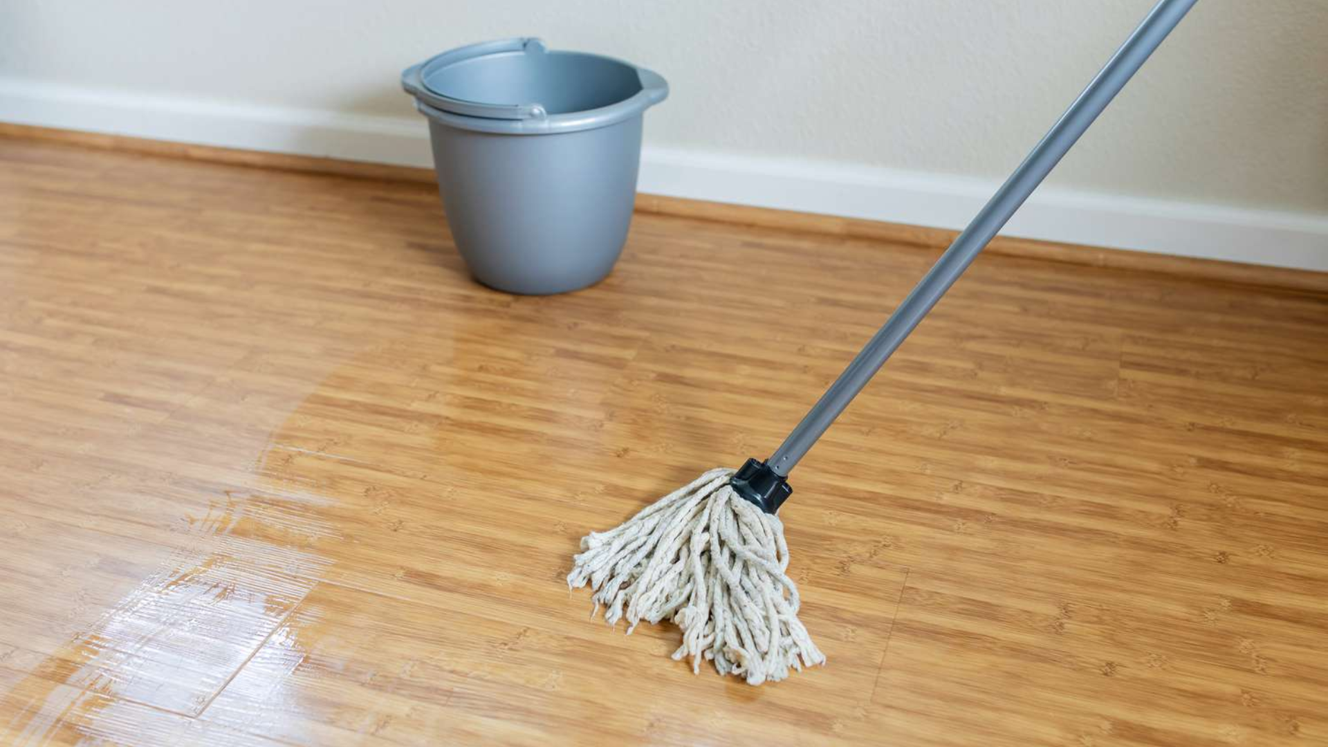 mopping floor as part of weekly house cleaning routine