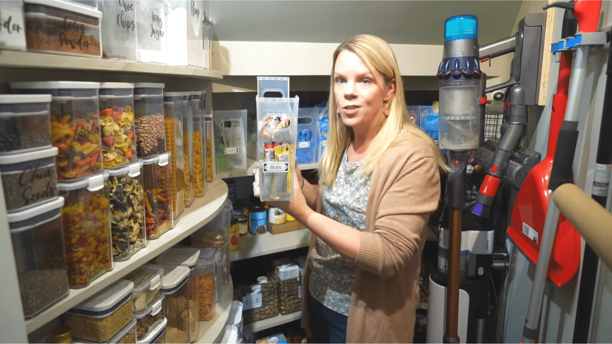 organized pantry with labeled containers and bins showing smart storage ideas for how to organize your home efficiently