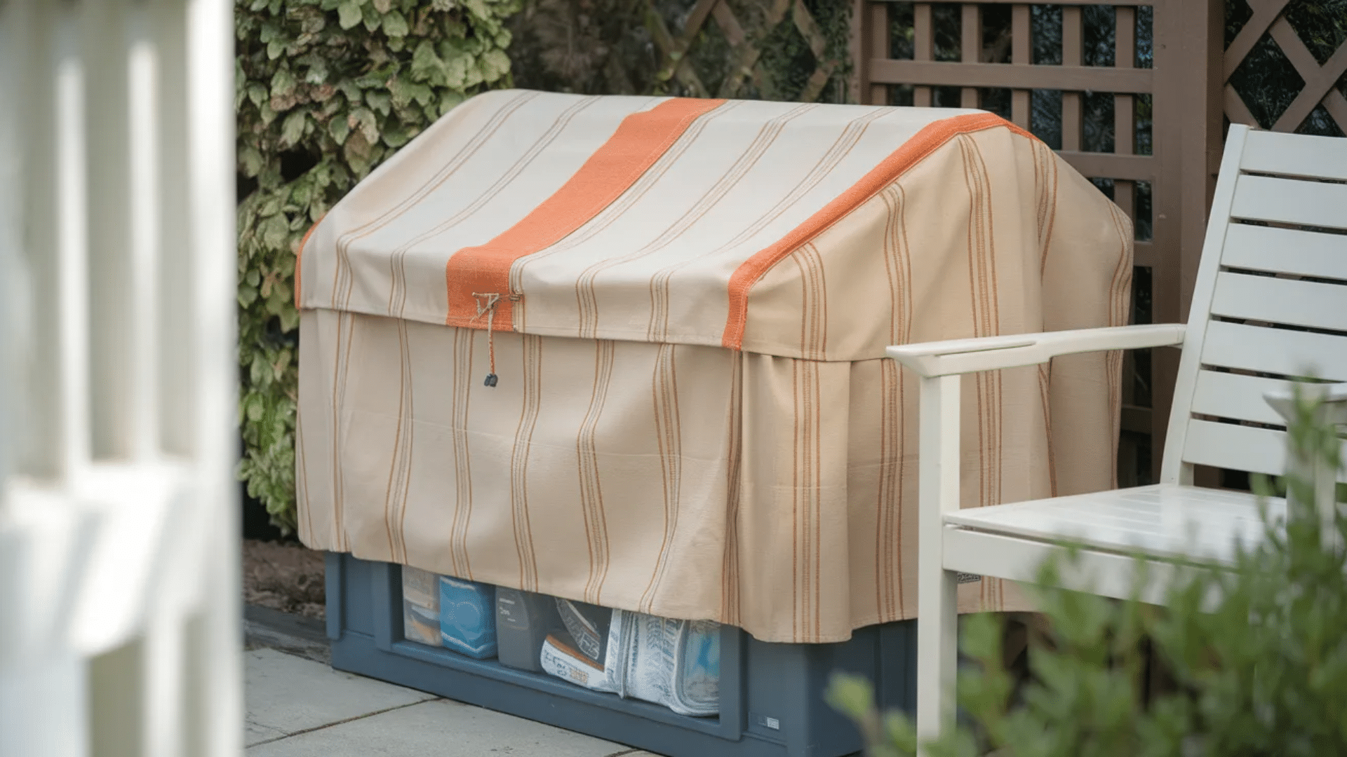 outdoor storage box covered with striped protective cover